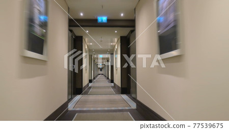 Timelapse of moving along the light hotel hall Timelapse of moving along the light hotel hall 77539675