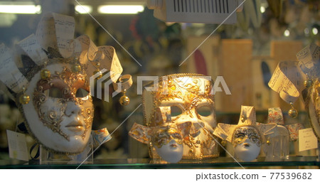 Fancy Venetian Carnival Masks Exposed on Shop Counter 77539682
