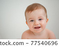 Portrait of a kid on a white background selective focus 77540696