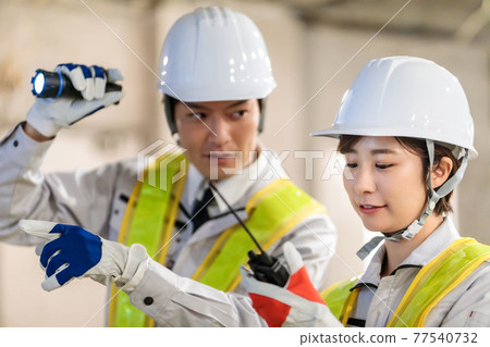 Workers using transceivers at construction sites 77540732