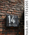 House number 14a outside on of the buildings the Auschwitz Birkenau 77541005