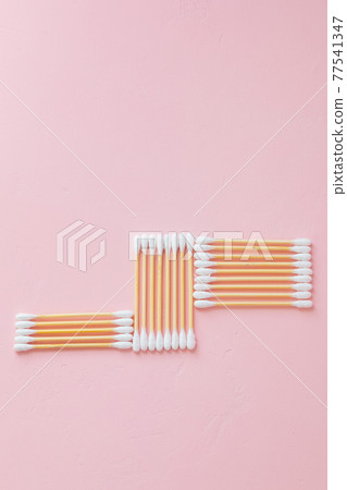 environmentally friendly bamboo and cotton cotton buds on a pink background, bamboo toothbrushes for adults and children. human personal hygiene products without harming the environment 77541347