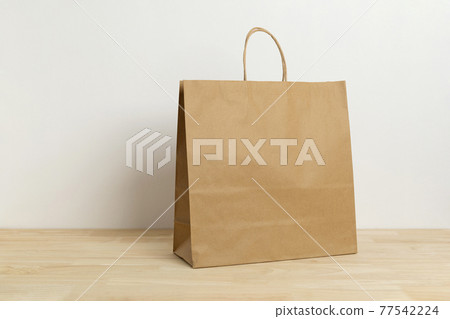 brown paper bag on wooden table for mockup blank template brown paper bag on wooden table for mockup blank template 77542224