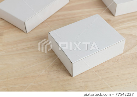 white paper box on wooden table for mockup blank template 77542227