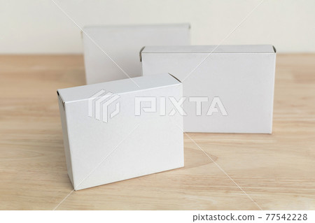 white paper box on wooden table for mockup blank template white paper box on wooden table for mockup blank template 77542228