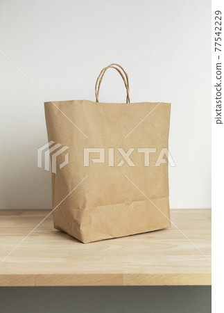 brown paper bag on wooden table for mockup blank template brown paper bag on wooden table for mockup blank template 77542229