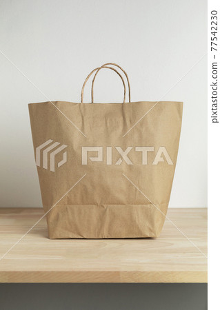 brown paper bag on wooden table for mockup blank template brown paper bag on wooden table for mockup blank template 77542230