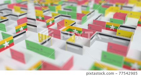 Flag of Myanmar on the mockup credit card maze. Financial difficulties related 3D rendering Flag of Myanmar on the mockup credit card maze. Financial difficulties related 3D rendering 77542985