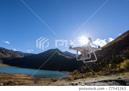 Flying drone taking photo of landscape in China Flying drone taking photo of landscape in China 77545263