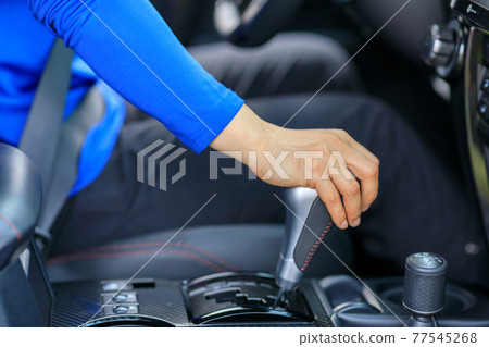 Driver driving car change the shifter Driver driving car change the shifter 77545268