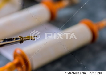 Torah Scrolls with a pointer on a Jewish temple synagogue Torah Scrolls with a pointer on a Jewish temple synagogue 77547909