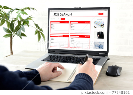 At hand of a man looking for a job on the Internet At hand of a man looking for a job on the Internet 77548161