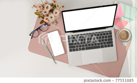 Mock up laptop computer with empty screen and mobile phone on female office desk. 77551085