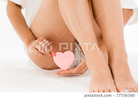 Woman with heart 77556380