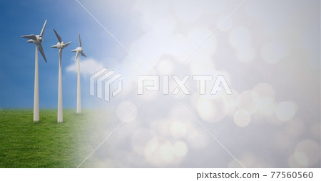 Composition of wind turbines in countryside with screen of smoke 77560560