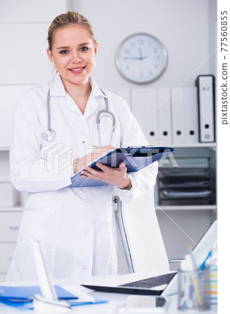 Female doctor in medical office 77560855