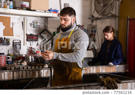 Portrait of confident welder in factory workshop Portrait of confident welder in factory workshop 77561216