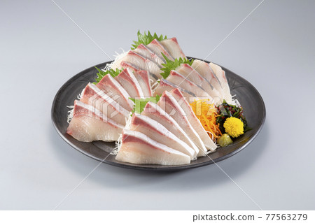 Yellowtail sashimi on a platter 77563279