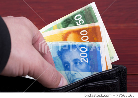 Banknotes from Israel in a black wallet Banknotes from Israel in a black wallet 77565163