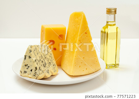 Fourme d'Ambert, cheese hit fitness on plate and sunflower oil Fourme d'Ambert, cheese hit fitness on plate and sunflower oil 77571223