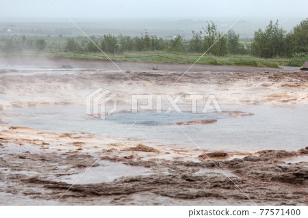 Strokkur geyser before discharging water, Iceland Strokkur geyser before discharging water, Iceland 77571400