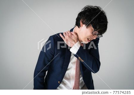 Businessman stiff shoulder tired 77574285