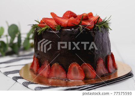 Delicious chocolate cake with strawberries 77575593