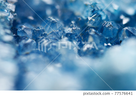 Beautiful texture of Blue crystals. mineral its blurred natural background. Winter Beautiful background. Macro Beautiful texture of Blue crystals. mineral its blurred natural background. Winter Beautiful background. Macro 77576641