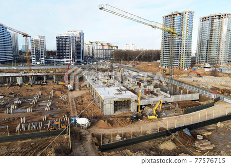 Drone view of a large construction site. Tower cranes in action. Housing renovation concept.  77576715