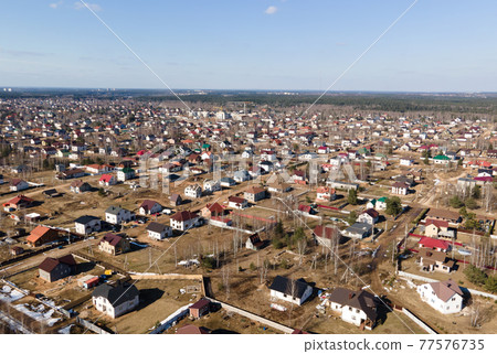 View from the house to modern country houses in the countryside. Country house view from air View from the house to modern country houses in the countryside. Country house view from air 77576735