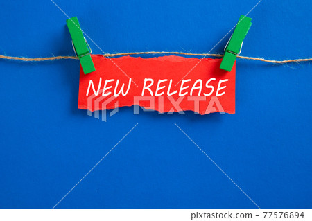 Hanging torn paper with new release word Hanging torn paper with new release word 77576894