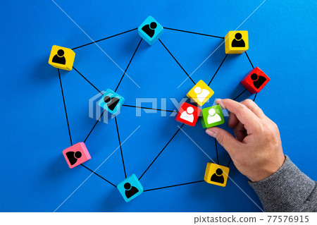 Wooden cube block print screen person icon which link connection network for organisation structure Wooden cube block print screen person icon which link connection network for organisation structure 77576915