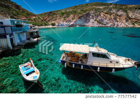 The beach of Firapotamos in Milos, Greece 77577542