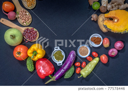 top view Fresh food is placed on a black table 77578446