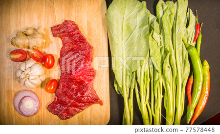 top view Fresh meat on a cutting board. top view Fresh meat on a cutting board. 77578448
