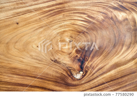 Texture of live edge suar wood slab with knot closeup 77580290