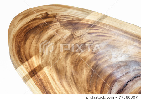 Dining table of live edge suar wood slab on white background Dining table of live edge suar wood slab on white background 77580307