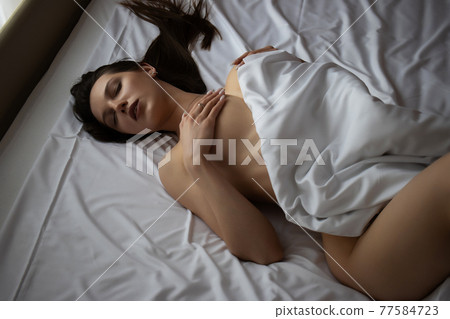 Seductive nude woman in bed Seductive nude woman in bed 77584723