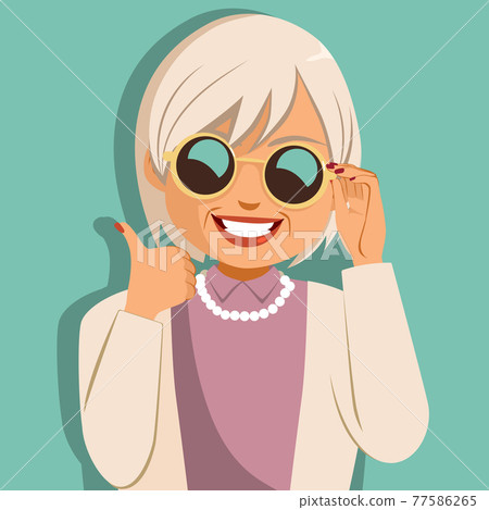 Funny cheerful old woman holding sunglasses making thumbs up hand gesture Funny cheerful old woman holding sunglasses making thumbs up hand gesture 77586265