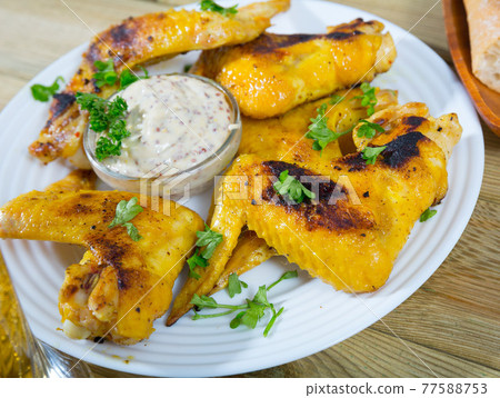 Baked chicken wings with mustard sauce Baked chicken wings with mustard sauce 77588753