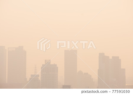 The buildings with yellow smoke in the morning, Smog in the city from PM 2.5 dust, Concept for copy space. The buildings with yellow smoke in the morning, Smog in the city from PM 2.5 dust, Concept for copy space. 77591030