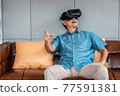 asian senior man enjoying when wearing VR headsets(vintage tone) 77591381