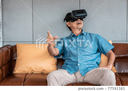 asian senior man enjoying when wearing VR headsets(vintage tone) asian senior man enjoying when wearing VR headsets(vintage tone) 77591381