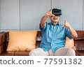 asian senior man enjoying when wearing VR headsets(vintage tone) 77591382