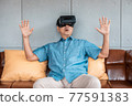 asian senior man enjoying when wearing VR headsets(vintage tone) 77591383