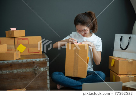 Young asian girl is freelancer with her private business at home office Young asian girl is freelancer with her private business at home office 77592582