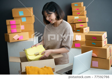 Young asian girl is freelancer with her private business at home office Young asian girl is freelancer with her private business at home office 77592766