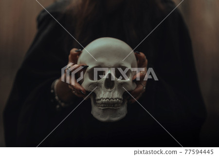 skull of a dead man in the hands of a witch witch skull of a dead man in the hands of a witch witch 77594445