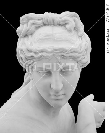 Ancient white marble sculpture head of young woman. Statue of sensual renaissance art era woman antique style. Face isolated on black background Ancient white marble sculpture head of young woman. Statue of sensual renaissance art era woman antique style. Face isolated on black background 77595367
