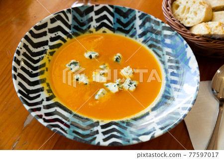 Creamy carrot soup with gorgonzola Creamy carrot soup with gorgonzola 77597017